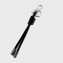 Abro Dalia Taschenanhänger aus schwarzem Leder mit Knotenoptik