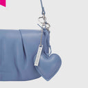 Les Visionnaires Heart Charm Cozy als Taschenanhänger an Handtasche befestigt celest